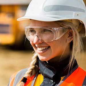 Worker wearing a hard hat and safety glasses